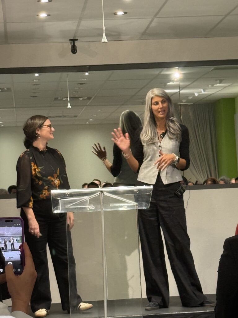 Layla Shea and Bronwen Ward of Upwords on stage at the QRCA Best of Canada Symposium